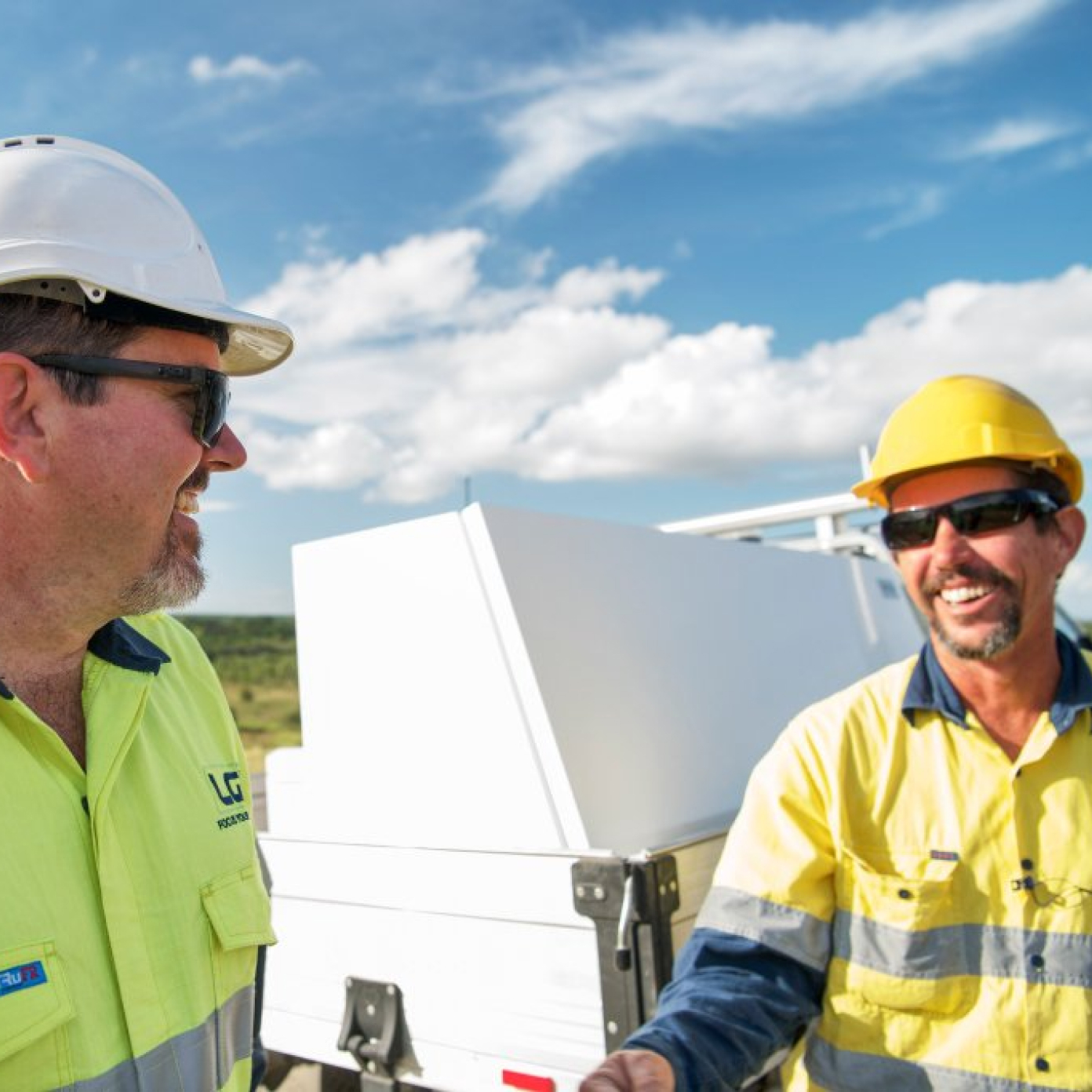 LGI staff smiling at each other onsite